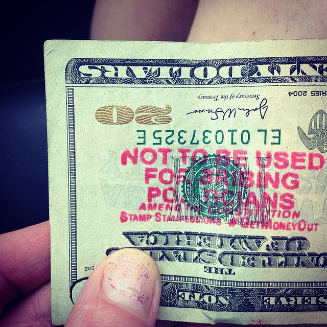 twenty dollar bill with a stamp that reads "not to be used for bribing politicians"